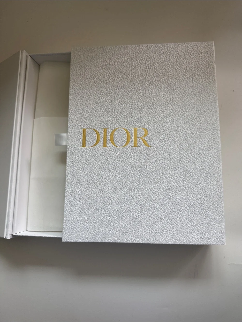 A Large Textured Christian Dior Gold Logo Gift Box With Ribbon Side Closure